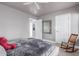 Clean bedroom with neutral walls, ceiling fan, a decorative mirror and plush bedding at 8061 E Lavender Dr, Gold Canyon, AZ 85118