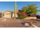 Charming single-story home featuring a desert landscape, wide driveway, and a two-car garage at 8061 E Lavender Dr, Gold Canyon, AZ 85118