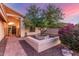 Inviting front entrance with brick walkway, desert landscaping, and mature shade tree at 8061 E Lavender Dr, Gold Canyon, AZ 85118