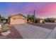 Charming single-Gathering home featuring a two-car garage, desert landscaping, and mature Saguaro cactus at 8061 E Lavender Dr, Gold Canyon, AZ 85118