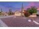 Charming single-Gathering home featuring a two-car garage, desert landscaping, and mature Saguaro cactus at 8061 E Lavender Dr, Gold Canyon, AZ 85118