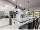 Open-concept kitchen island with granite countertops and seating, perfect for entertaining at 8061 E Lavender Dr, Gold Canyon, AZ 85118