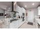 Modern kitchen featuring white cabinets, granite countertops, and stainless steel appliances at 8061 E Lavender Dr, Gold Canyon, AZ 85118