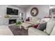 Comfortable living room with a stone fireplace, large area rug, and neutral color palette at 8061 E Lavender Dr, Gold Canyon, AZ 85118