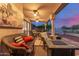 Comfortable covered patio with ceiling fans, seating, and a view of the pool at 8061 E Lavender Dr, Gold Canyon, AZ 85118
