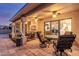 Covered patio with ceiling fans and multiple seating areas for outdoor enjoyment at 8061 E Lavender Dr, Gold Canyon, AZ 85118