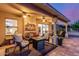 Inviting covered patio with comfortable seating, ceiling fans, and tiled flooring at 8061 E Lavender Dr, Gold Canyon, AZ 85118