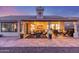 Home's covered patio features stylish furnishings, ceiling fans, and ample space for entertaining at 8061 E Lavender Dr, Gold Canyon, AZ 85118