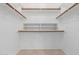Well-organized walk-in closet with shelving and hanging rods for ample storage space at 8061 E Lavender Dr, Gold Canyon, AZ 85118
