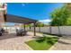 Spacious backyard with patio, pergola, artificial turf, and a swing set at 8219 N 3Rd Ave, Phoenix, AZ 85021