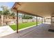 Inviting backyard with covered patio, manicured lawn, and a gazebo lounge area at 8343 W Paradise Dr, Peoria, AZ 85345