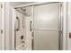 Well-maintained bathroom with a shower and frosted glass enclosure with hand rails at 8343 W Paradise Dr, Peoria, AZ 85345