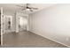 Bright bedroom showcasing sleek wood-style floors and a mirrored closet at 8343 W Paradise Dr, Peoria, AZ 85345