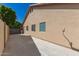 Long driveway leading to the side of the house with a fenced-in area for storage at 8343 W Paradise Dr, Peoria, AZ 85345