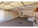 Spacious garage featuring built-in storage cabinets and bonus sofa seating at 8343 W Paradise Dr, Peoria, AZ 85345