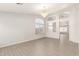 Elegant living room with stylish chandelier and abundant natural light at 8343 W Paradise Dr, Peoria, AZ 85345