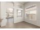 Bright living room with arched windows, stylish lighting, and open layout at 8343 W Paradise Dr, Peoria, AZ 85345