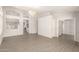 Open concept living room featuring arched doorways and wood-style floors at 8343 W Paradise Dr, Peoria, AZ 85345