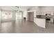 A living room featuring a fireplace, vaulted ceilings, and wood look tile floors at 8343 W Paradise Dr, Peoria, AZ 85345