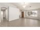 Spacious living room with wood-style flooring and multiple access points at 8343 W Paradise Dr, Peoria, AZ 85345