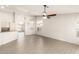 A spacious living room featuring high ceilings and wood look tile floors at 8343 W Paradise Dr, Peoria, AZ 85345