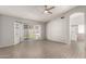 Bright main bedroom with sliding glass doors to the yard, and an archway to the main bathroom at 8343 W Paradise Dr, Peoria, AZ 85345