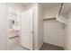 View from walk-in closet showcasing the spacious layout and connection to the main bathroom at 8343 W Paradise Dr, Peoria, AZ 85345