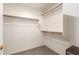 Walk-in closet with built-in shelving and rods for organization, offering ample storage space at 8343 W Paradise Dr, Peoria, AZ 85345