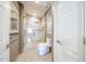 Bright bathroom featuring tiled shower, white toilet, and neutral paint at 8880 E Paraiso Dr # 120, Scottsdale, AZ 85255
