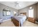 Cozy bedroom featuring travertine floors, a comfortable bed, and natural light; an inviting retreat at 8880 E Paraiso Dr # 120, Scottsdale, AZ 85255