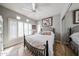 Comfortable bedroom with a mirrored closet, shutters, and neutral colored walls at 8880 E Paraiso Dr # 120, Scottsdale, AZ 85255