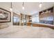Contemporary kitchen with a large marble island, stainless steel appliances, and custom wood cabinetry at 8880 E Paraiso Dr # 120, Scottsdale, AZ 85255