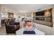 Spacious living area featuring travertine floors and an open layout with views into the kitchen and dining space at 8880 E Paraiso Dr # 120, Scottsdale, AZ 85255