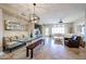 Bright and airy living room with modern lighting, travertine floors, and comfortable seating areas at 8880 E Paraiso Dr # 120, Scottsdale, AZ 85255