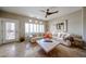 Cozy living room with travertine floors, white sofa, and an accent table, perfect for relaxing and entertaining at 8880 E Paraiso Dr # 120, Scottsdale, AZ 85255