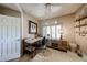Office with neutral walls, ceiling fan, shutters, and wood furniture at 8880 E Paraiso Dr # 120, Scottsdale, AZ 85255