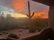 Backyard view with a beautiful sunset over desert landscaping at 8880 E Paraiso Dr # 120, Scottsdale, AZ 85255