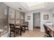 Cozy breakfast nook with large windows, table for two and tiled floors at 10124 E Michigan Ave, Sun Lakes, AZ 85248
