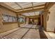 A covered walkway provides shade and access, accented by sunlit shadows and community postings at 10124 E Michigan Ave, Sun Lakes, AZ 85248