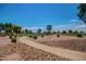 Beautiful view of the golf course with a pathway leading to the course at 10124 E Michigan Ave, Sun Lakes, AZ 85248
