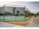 Wide shot of exterior tennis court featuring net fencing at 10124 E Michigan Ave, Sun Lakes, AZ 85248