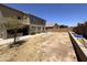 Large backyard featuring a covered patio with outdoor kitchen and a block wall for added privacy at 10347 W Odeum Ln, Tolleson, AZ 85353