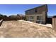 Large backyard with patio, AC unit, block wall, and ample space for outdoor activities at 10347 W Odeum Ln, Tolleson, AZ 85353
