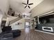Stylish living area with a soaring ceiling and view of the second story balcony at 10347 W Odeum Ln, Tolleson, AZ 85353