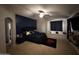 Cozy main bedroom features an accent wall, carpet, ceiling fan and a cute window nook at 10347 W Odeum Ln, Tolleson, AZ 85353