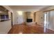 Cozy living room featuring laminate wood flooring, brick fireplace, and sliding doors to the outside at 1103 E Palmcroft Dr, Tempe, AZ 85282