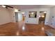 Open living room with laminate wood flooring, neutral paint, open doorway, and ample natural light at 1103 E Palmcroft Dr, Tempe, AZ 85282