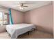 Bedroom featuring a ceiling fan, large window, and tan walls with new drywall at 1123 W Mendoza Ave, Mesa, AZ 85210