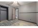 Bedroom showcasing gray walls, unique flooring detail, and a closet with open door at 1123 W Mendoza Ave, Mesa, AZ 85210