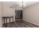 Inviting dining room with wood floors, a chandelier, and neutral walls at 1123 W Mendoza Ave, Mesa, AZ 85210